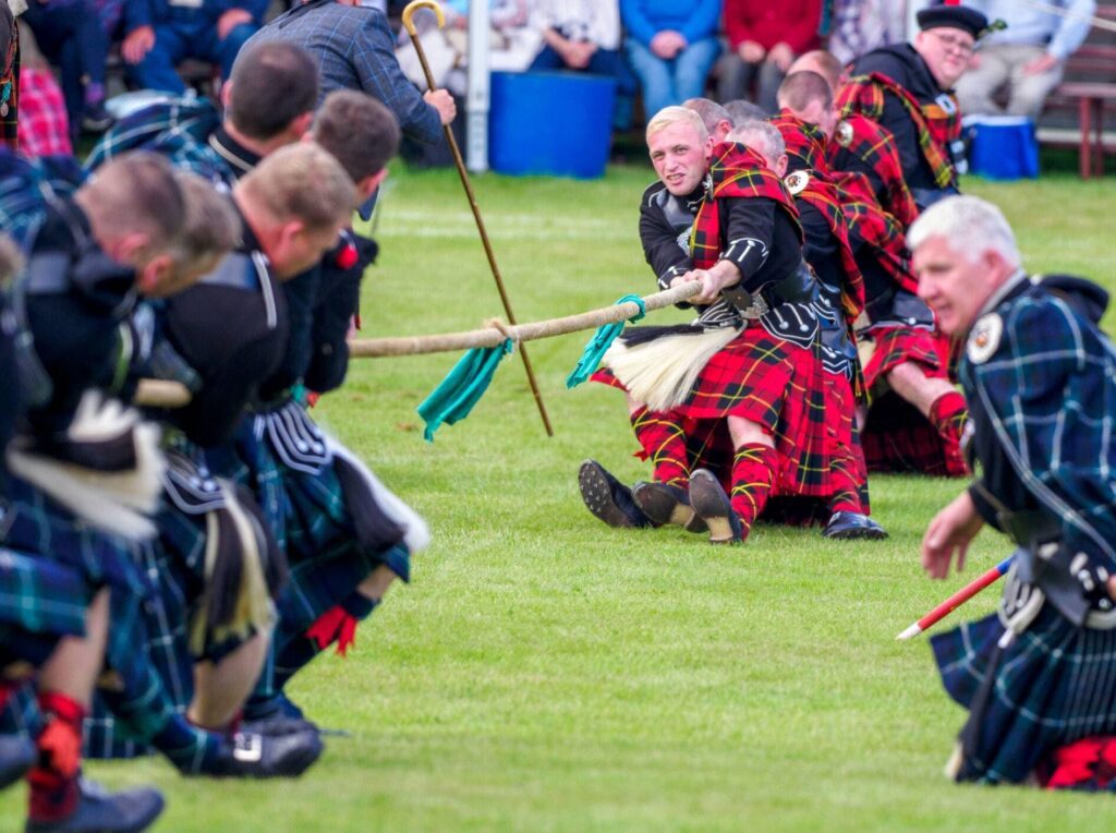 Athletes Ignite Tradition and Power in Thrilling Highland Games Showdown