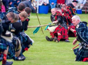 Athletes Ignite Tradition and Power in Thrilling Highland Games Showdown