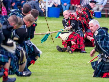 Athletes Ignite Tradition and Power in Thrilling Highland Games Showdown